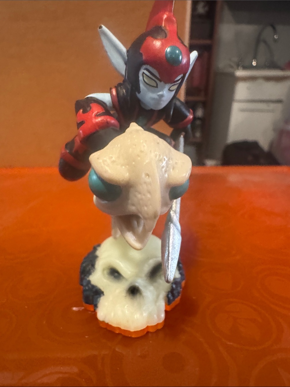 Skylander giants.Red and Black Warrior Figurine with Cream Snake and Skull Base